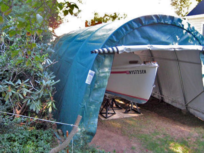 12x20 round portable garage with boat inside